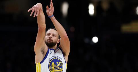 Steph Curry following through on his shot during a game against the Washington Wizards.