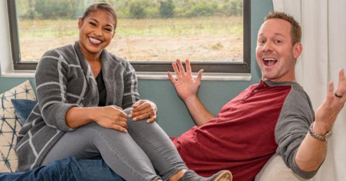 Mika and Brian Kleinschmidt pose for a photo while seated for '100 Day Dream House' promo