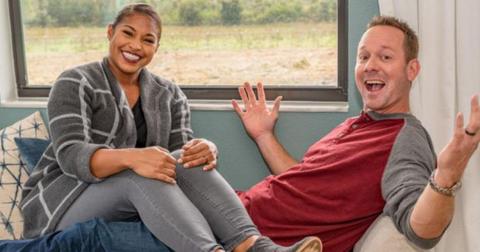 Mika and Brian Kleinschmidt pose for a photo while seated for '100 Day Dream House' promo