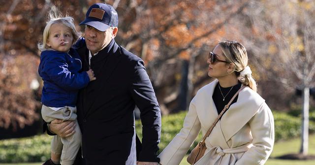 unter Biden, the son of U.S. President Joe Biden, holds his son Beau as he walks with his wife Melissa Cohen on the South Lawn of the White House on December 04, 2022 in Washington, DC.
