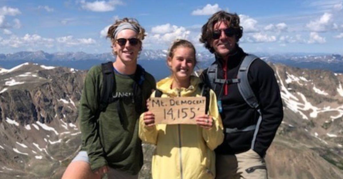 Brett James with his kids at the top of a mountain in Colorado. 