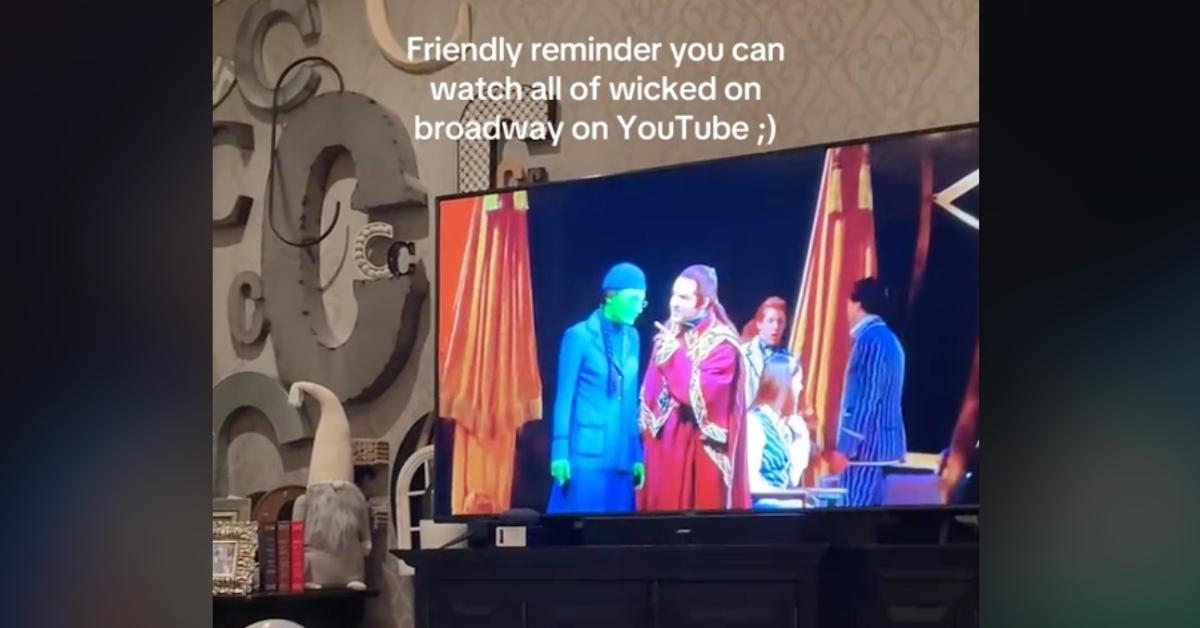 A TikTok video of 'Wicked' playing on the TV captioned "slime tutorial." 