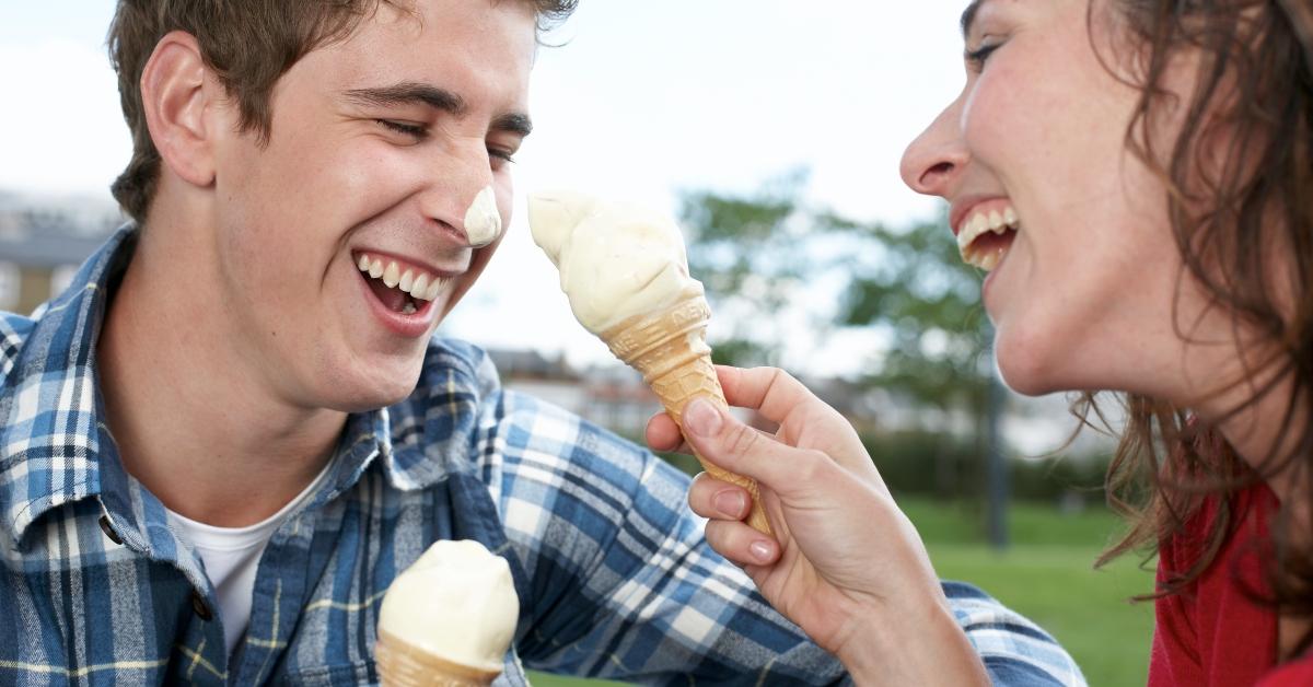 Two people eating ice cream cones