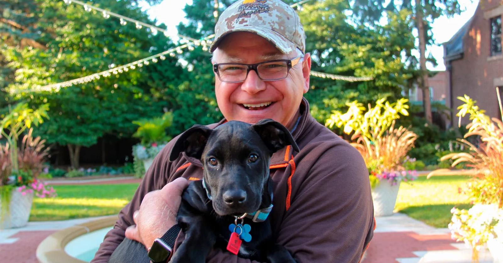 Tim walz and dog scout