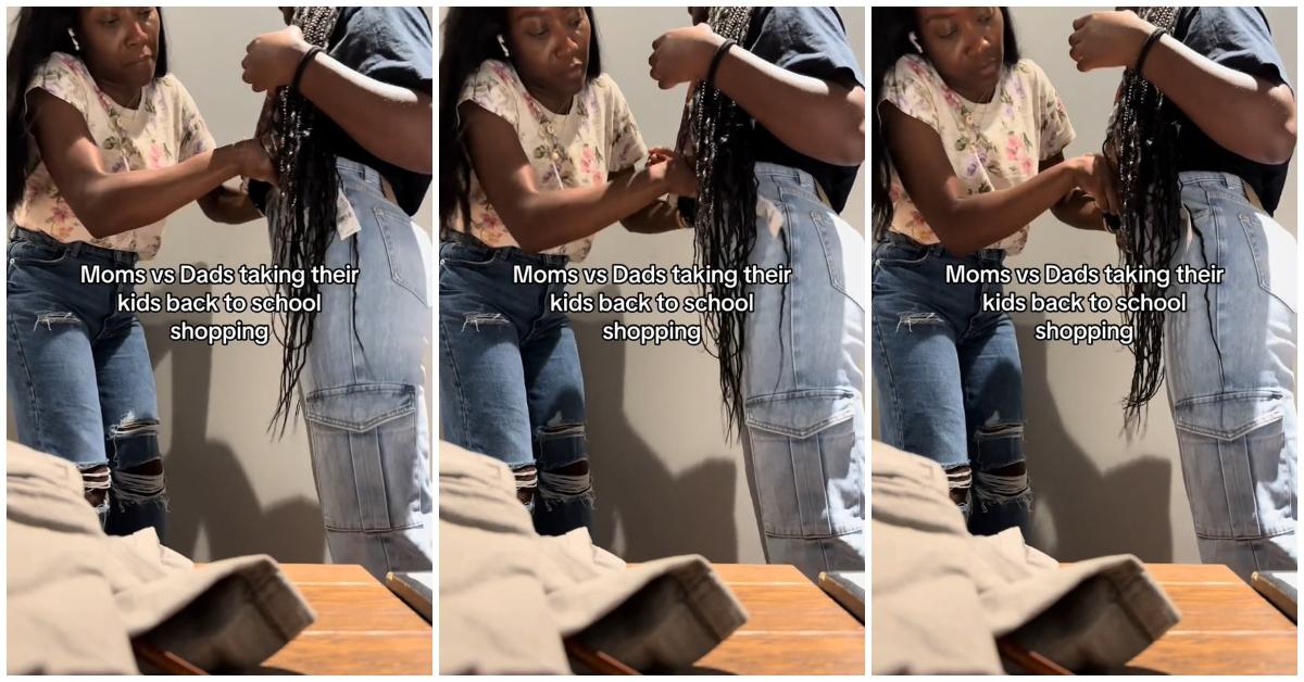 A mom helping her daughter try on clothes during back-to-school shopping