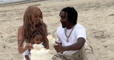 Cam and Nie looking confused after seeing white in their gender reveal cake.