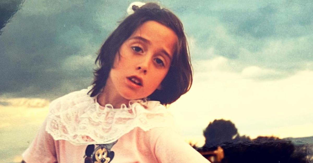 Catherine Reitman young wearing a Minnie Mouse shirt.