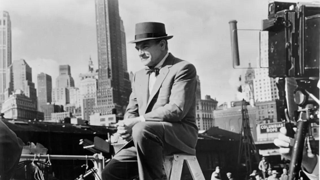 James Cagney sitting on a ladder in 1950