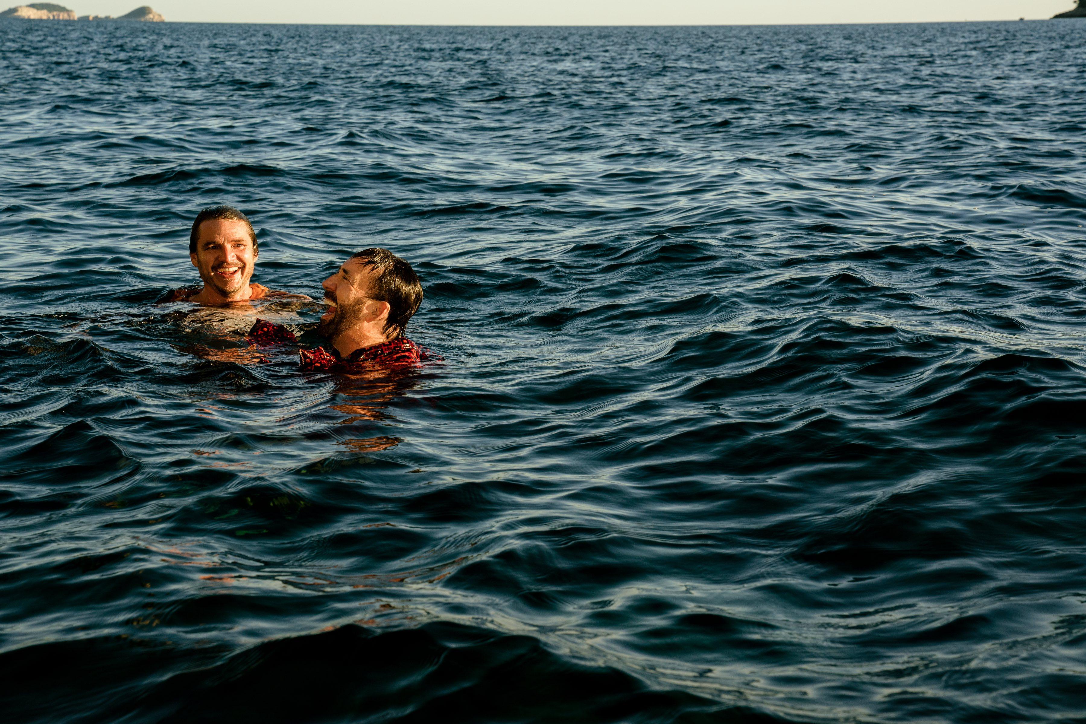 Nicolas Cage and Pedro Pascal in the sea in 'The Unbearable Weight of Massive Talent.'