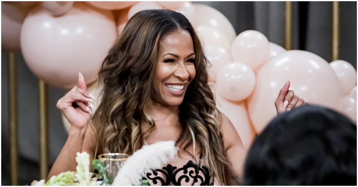 Sheree Whitfield smiling during a scene of 'RHOA' 