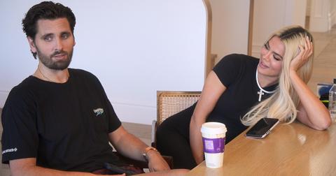 Scott Disick and Khloe Kardashian sit together at a table on The Kardashians