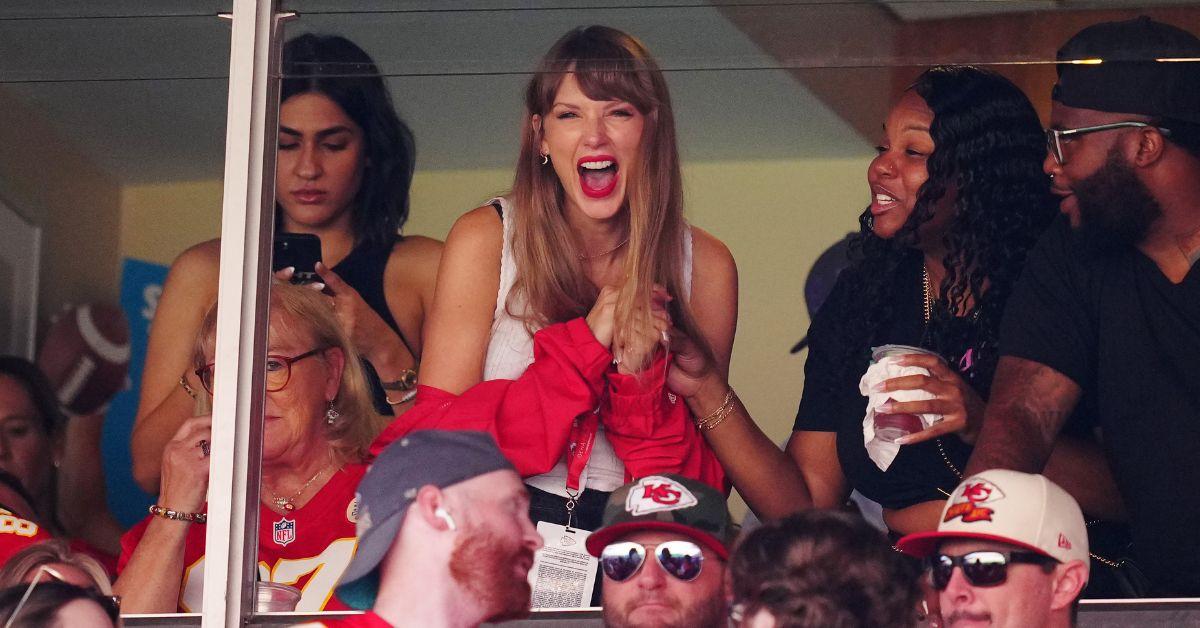 Taylor Swift at a Chiefs game in a tank top. 