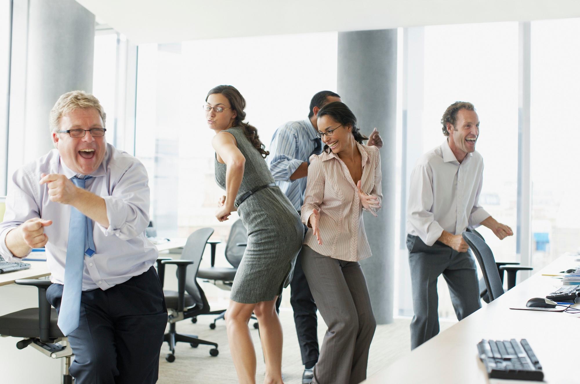 Business people dancing in office