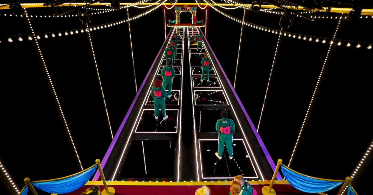 'Squid Game: The Challenge' players attempting to cross the Glass Bridge.