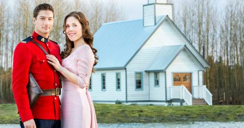 Jack and Elizabeth in 'When Calls the Heart' standing by a white house.
