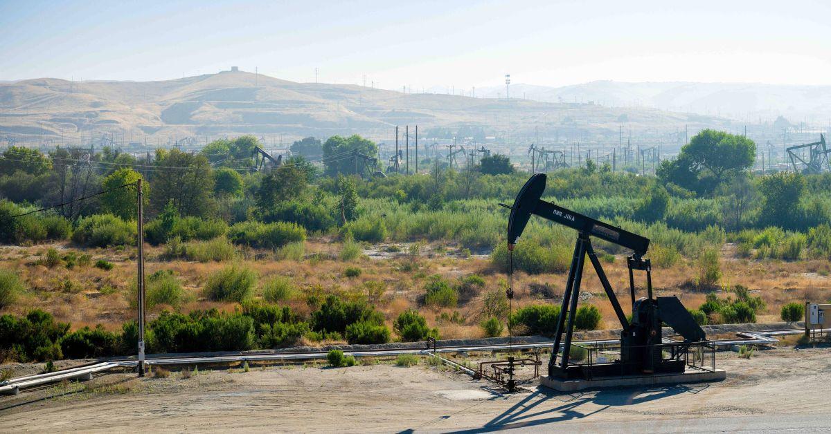 An oil rig with Big Sur in the background in California. 