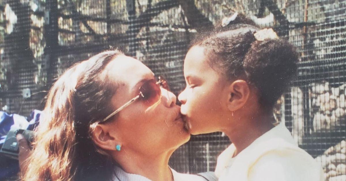 (l-r): Savannah Lee Smith's mother and her sharing a kiss outside. 