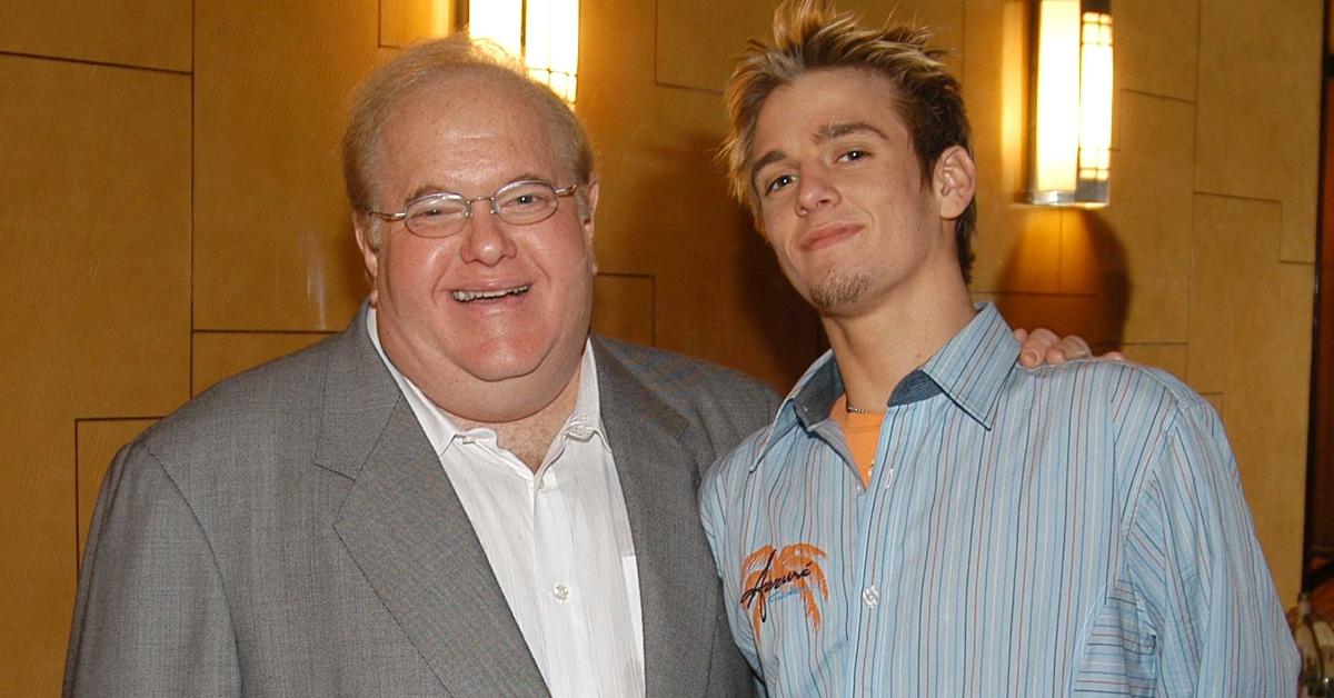 Lou Pearlman poses with Aaron Carter