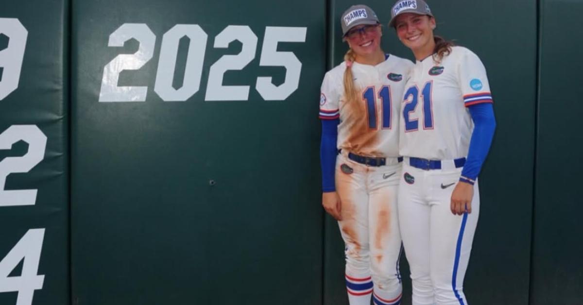 Mia Williams with a Gators teammate on the field.