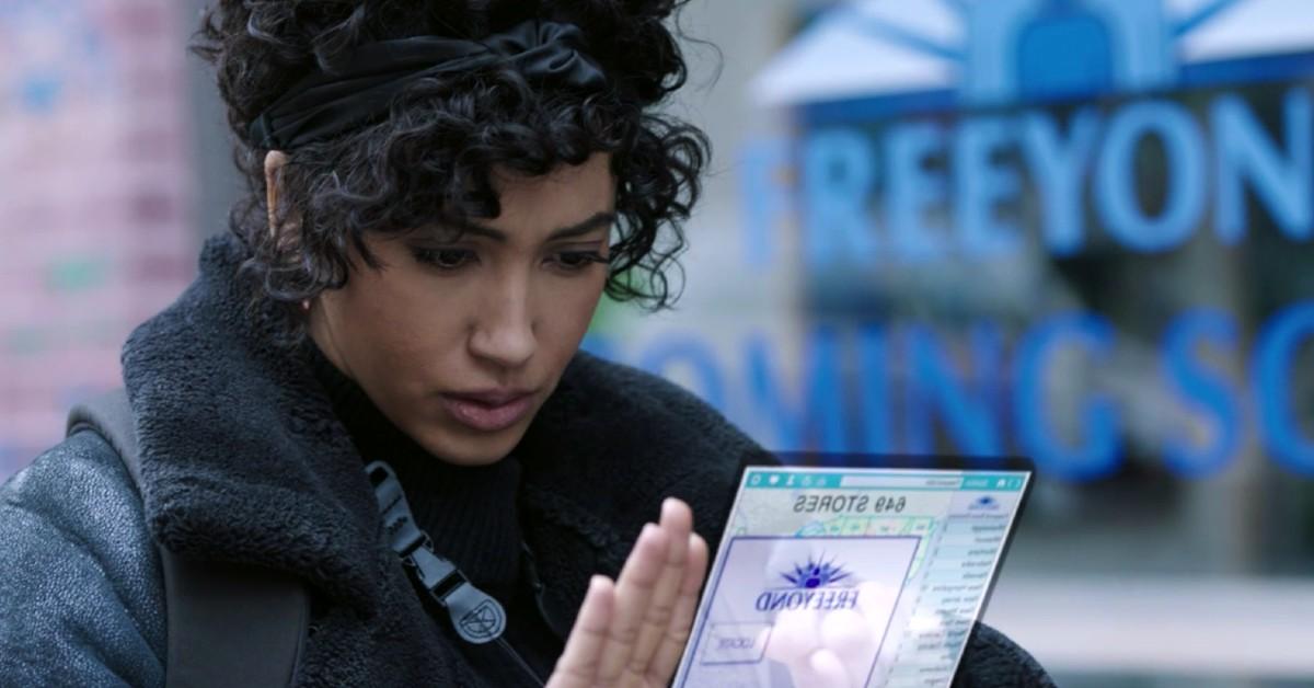 Nora (Andy Allo) investigates Freeyond. 