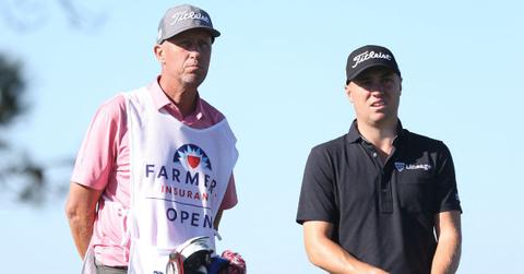 Justin Thomas with his caddy at the Farmers Insurance Open in 2022.