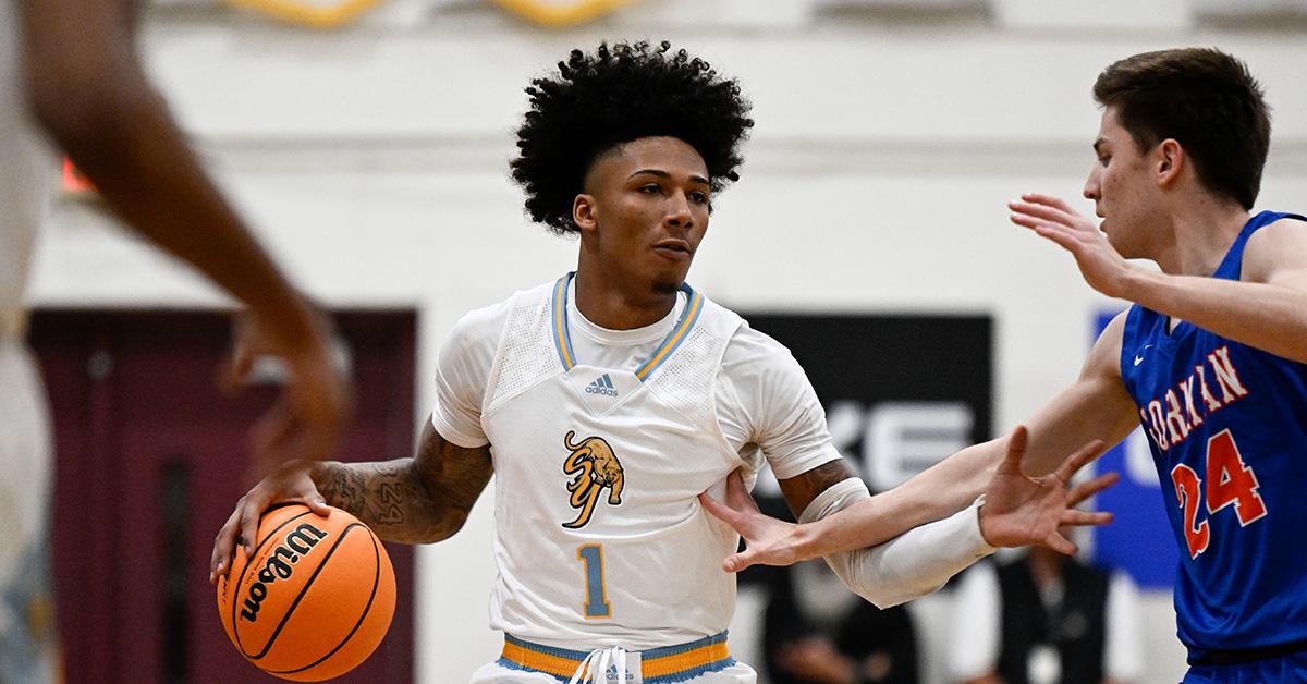 Mikey Williams dribbling a basketball during a high school game. 