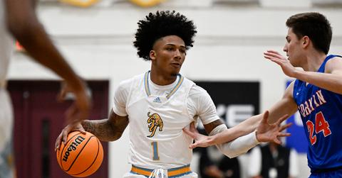 Mikey Williams dribbling a basketball during a high school game.