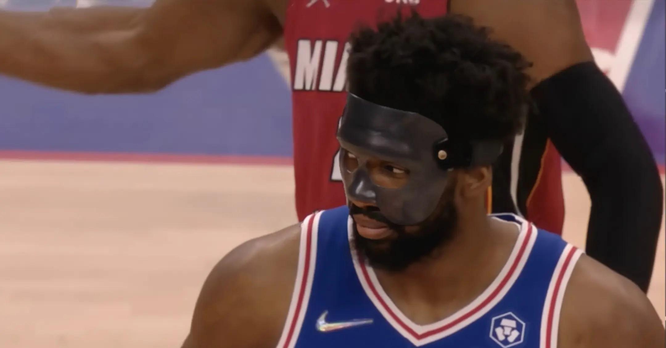 Joel Embiid wearing a mask during a 76ers game.