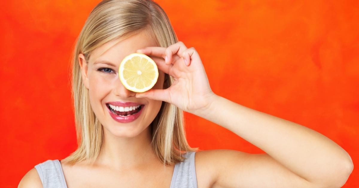 woman holding a lemon