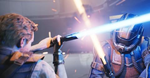 'Star Wars Jedi: Survivor' Cal Kestis and an enemy in a lightsaber struggle.