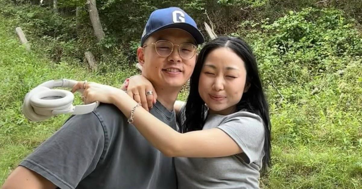 Sarah Kim and her husband Andrew outdoors.