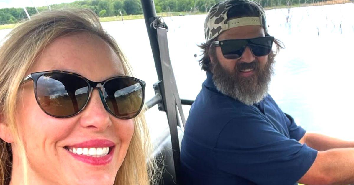 Jessica and Jep Robertson in a golf cart. 