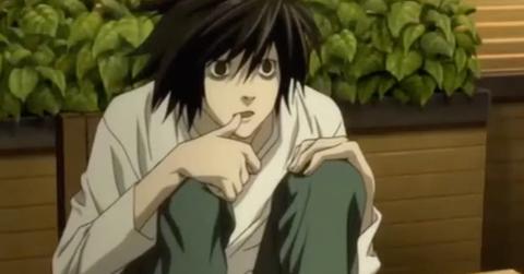 L from Death Note sits