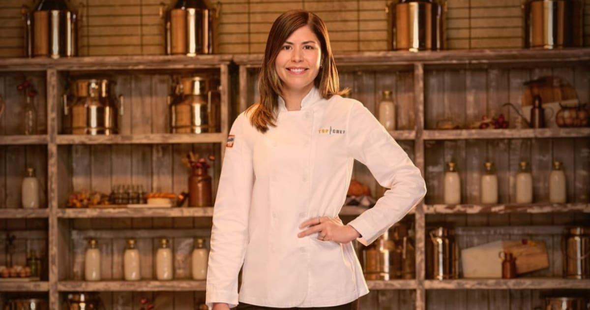 Laura wears a white chef's jacket for her official 'Top Chef: Wisconsin' portrait.