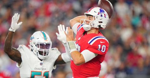 New England Patriots quarterback Mac Jones (10) in action, throws the football vs. Miami Dolphins David Long Jr. (51) at Gillette Stadium. Foxborough, MA 9172023.