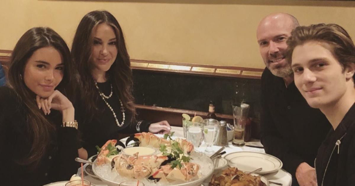 Madison Beer posing with her mom, Tracie Beer, her dad, Robert Beer, and her brother, Ryder Beer, during family dinner.