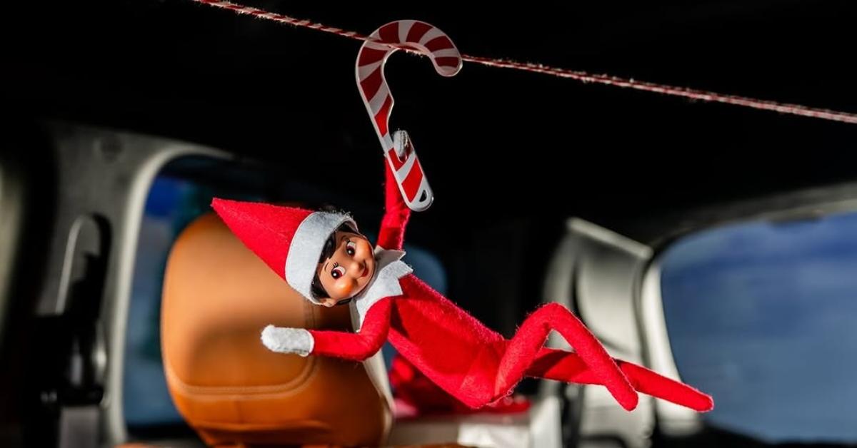 An Elf on the Shelf on a candy cane zipline.