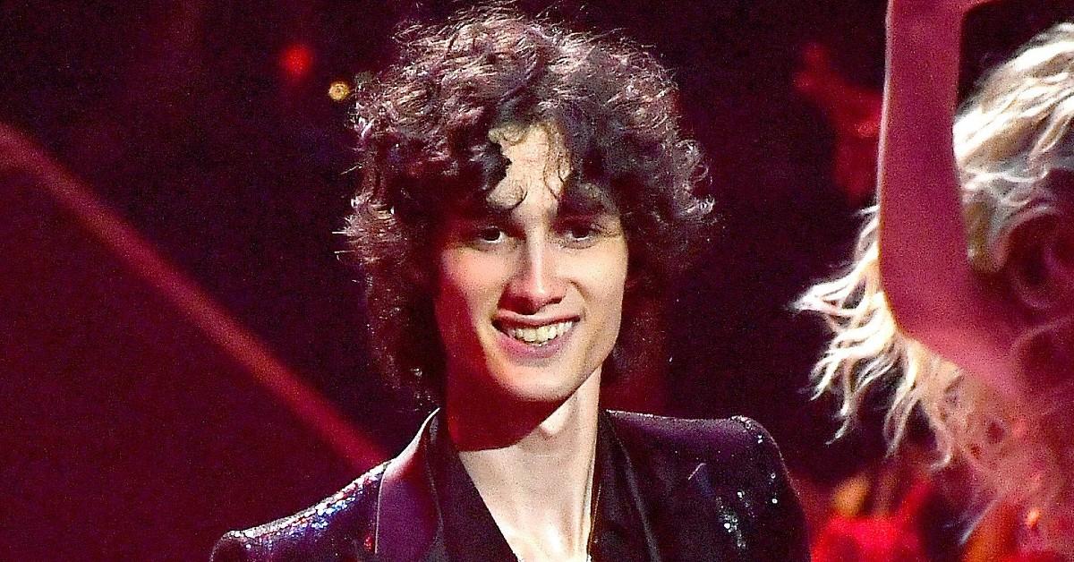 Sombr smiles while on the stage performing