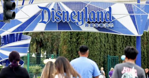 People walk toward an entrance to Disneyland on April 24, 2023 in Anaheim, California.