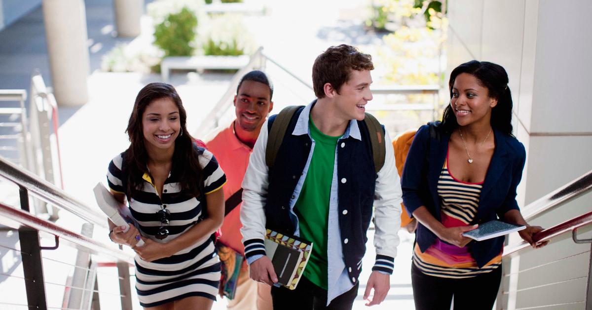 High school students walking up a flight of stairs.