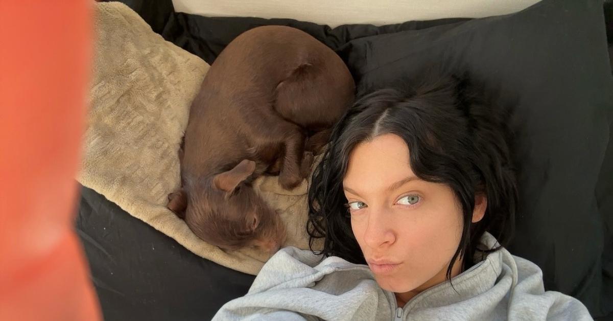 Macy Eleni posing with her dog, Freddy