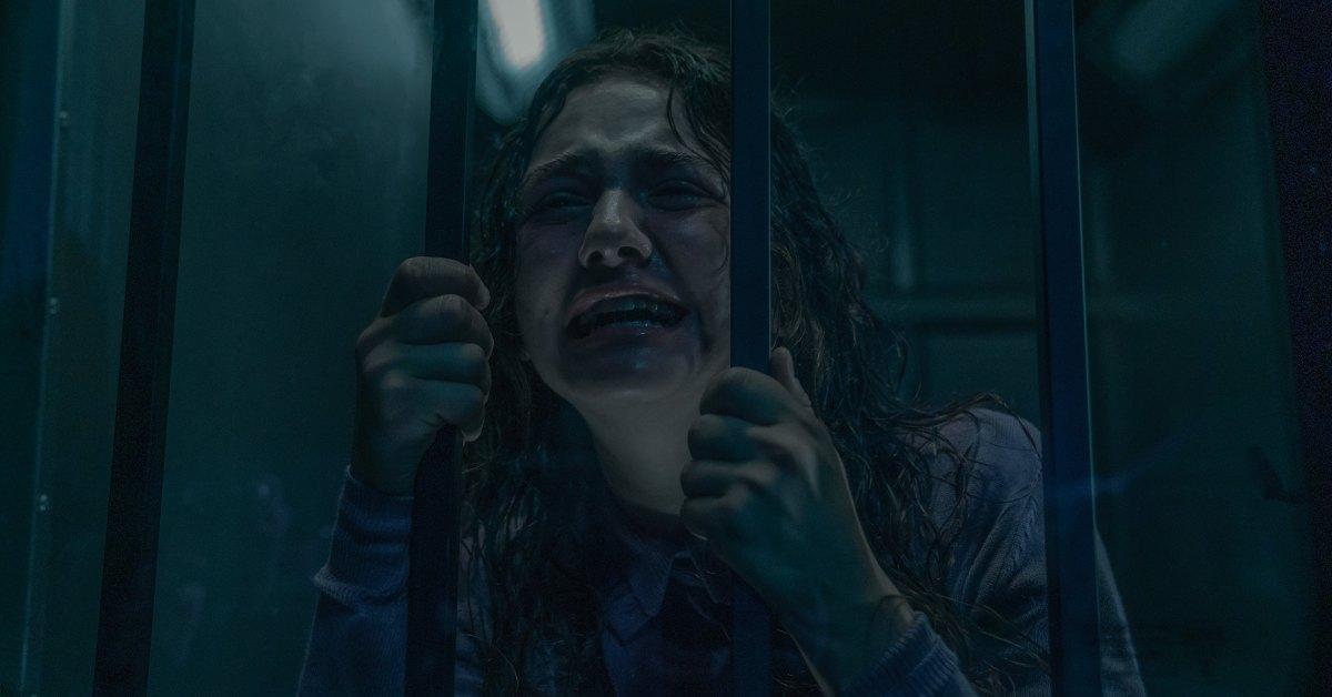 Becka being taken away after killing her father.