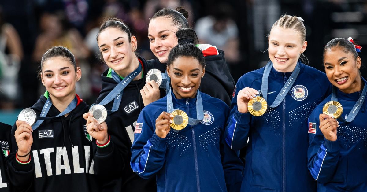 Competitors posing with their medals at the Olympics 2024