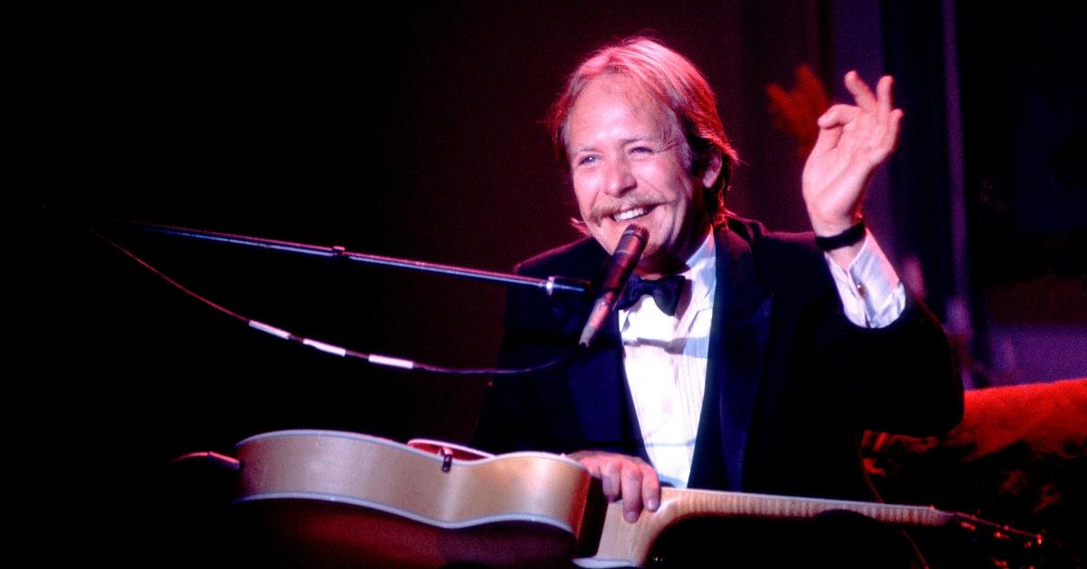 Martin Mull plays guitar as he performs onstage, Chicago, Ill.