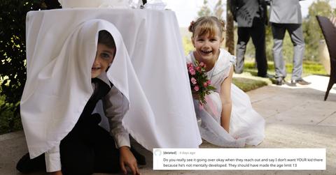 A boy and girl playing under a table at a wedding and a Reddit comment