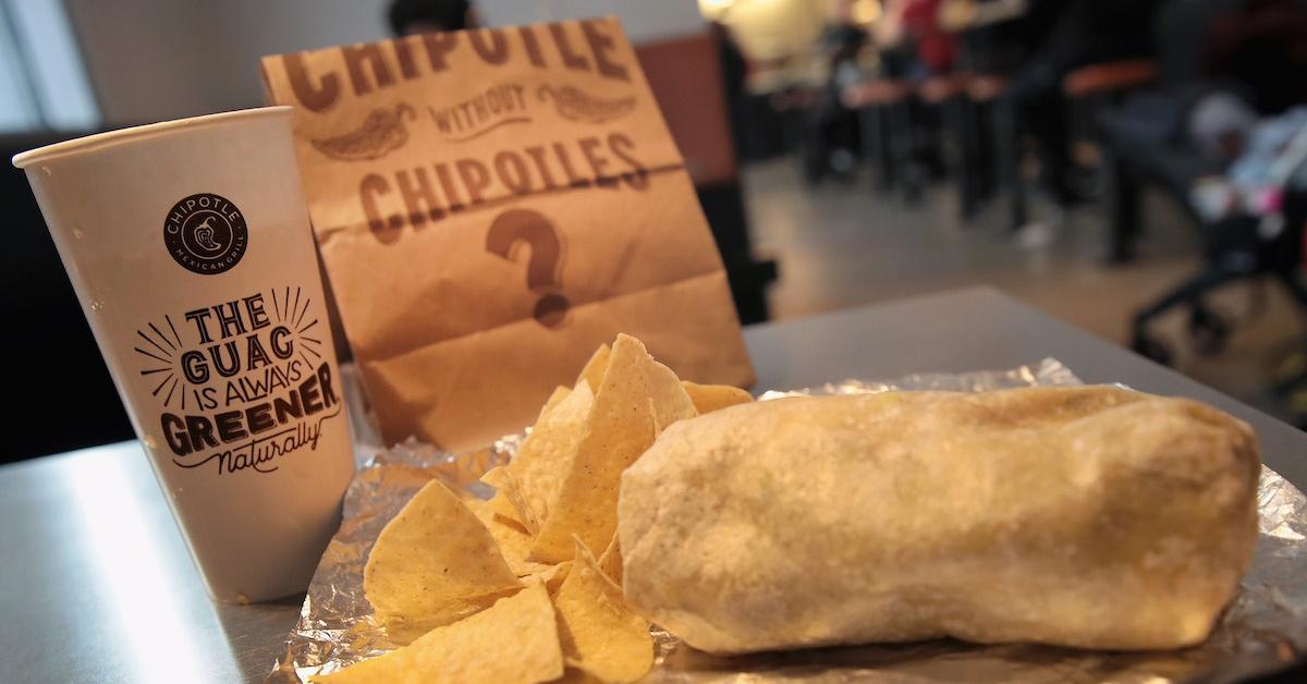 A chipotle order that consists of a burrito, chips, and a drink