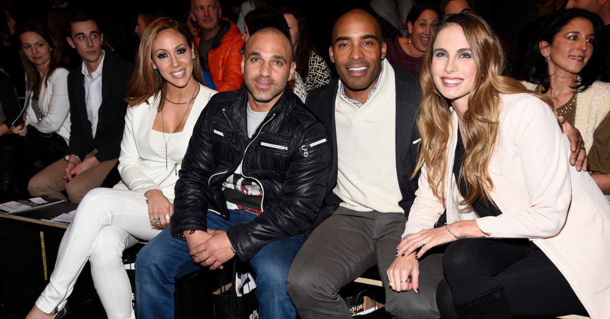 (l-r) Melissa Gorga, Joe Gorga, Tiki Barber, and Traci Johnson pose for a photo all seated next to each other at an event.