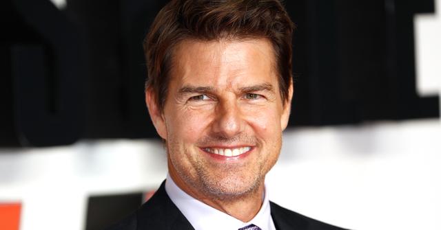 tom cruise smiling on the red carpet