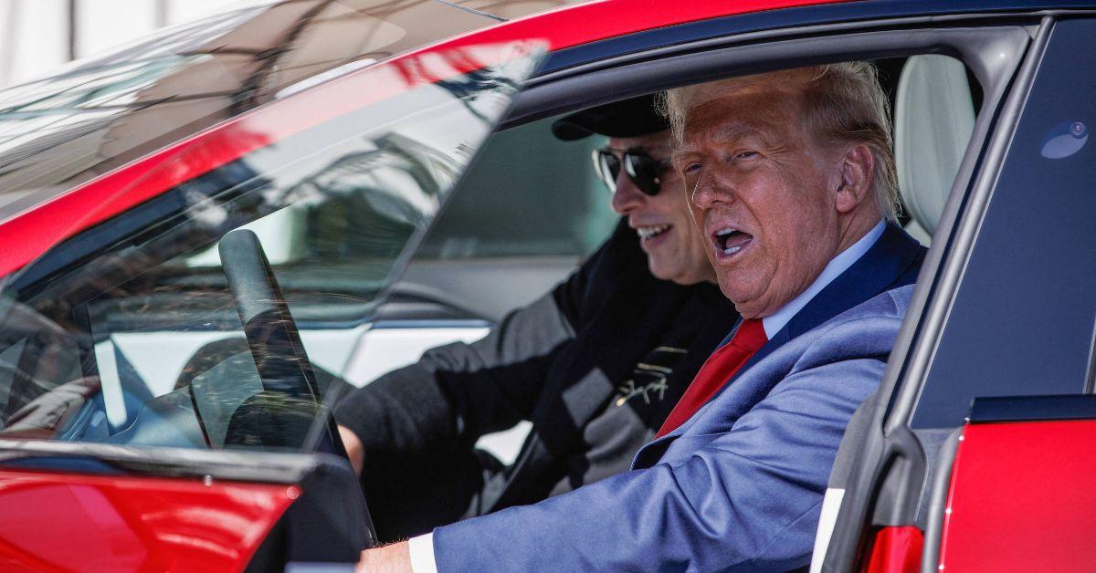 Donald Trump sitting in a Tesla with Elon Musk. 