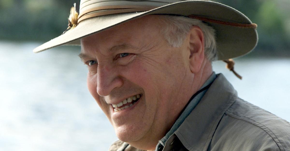Dick Cheney smiles during a fishing trip in 2001